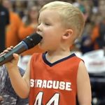 Brave toddler agrees to sing national anthem before crowd, only to have 6,000 people on their feet