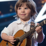 No one saw this coming, When this first grader took the stage and started singing a Johnny Cash classic, the entire audience was left in shock, His deep, soulful voice and flawless delivery sent chills through the crowd, leaving even the judges speechless